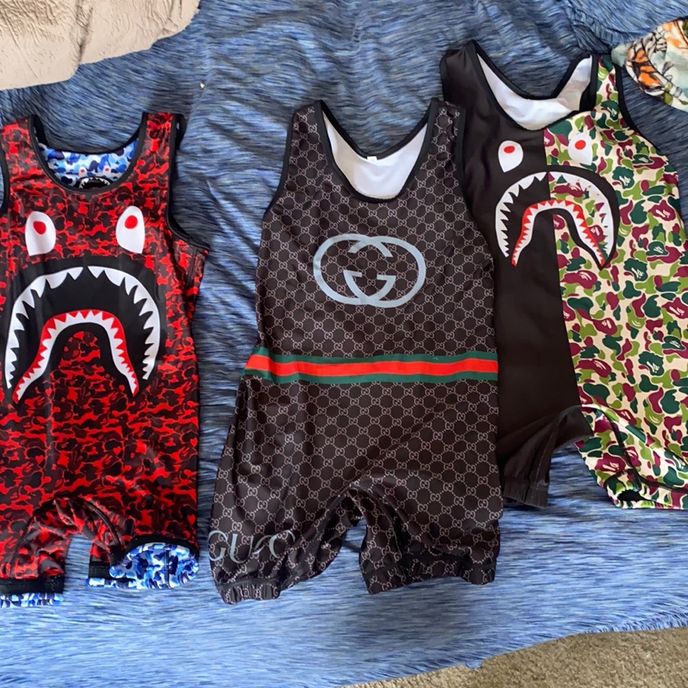 1 gucci singlet: 2 bape singlets (1 is reversible)